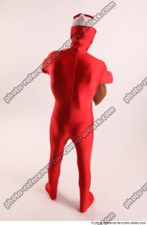 13 2019 01 JOEL ADAMSON CHRISTMASVILLAIN WITH GUN AND BAG